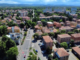 Obraz premium aerial view of Viale Umberto 1° in the southern area of the city of Reggio Emilia leading to the bridge over the Crostolo stream, Emilia Romagna, Italy