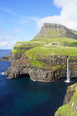 The stunning Mulafossur Waterfall in Gasadalur on the Faroe Islands
