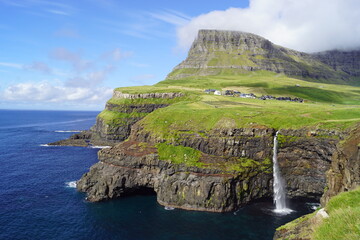 The stunning Mulafossur Waterfall in Gasadalur on the Faroe Islands