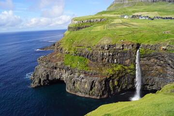 The stunning Mulafossur Waterfall in Gasadalur on the Faroe Islands