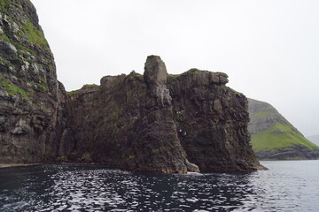 The steep and dramatic coastline around the Vestmanna Cliffs in the Atlantic Ocean off the Faroe Islands © ChrisOvergaard