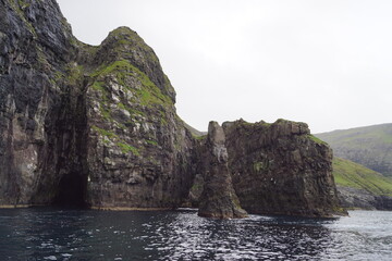 The steep and dramatic coastline around the Vestmanna Cliffs in the Atlantic Ocean off the Faroe Islands