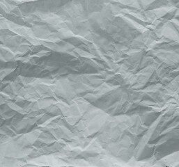 White crumpled paper texture isolated background, wrinkled sheet of paper with natural folds and creases, blank distressed surface for design mockup, collage, or vintage craft projects