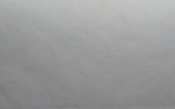 Gray paper texture background, clean wrinkled sheet with subtle folds and creases, plain blank surface for design mockup, collage, or minimalist craft projects