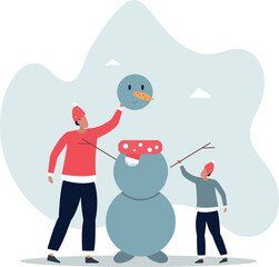 Father and son making a snowman. Winter fun for the family.