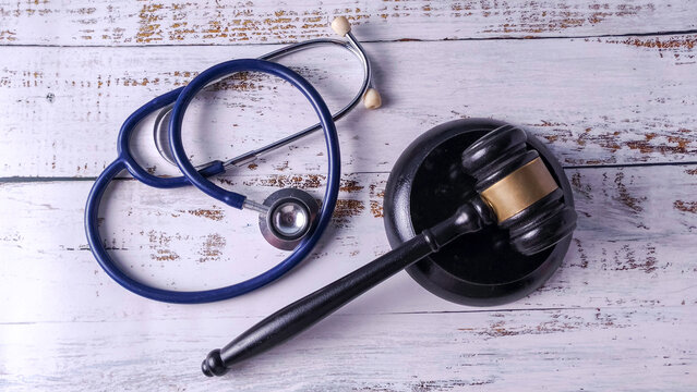 Stethoscope and Gavel on a Wooden Table: Medical Malpractice, Healthcare Law, and Ethical Regulation