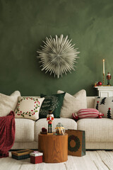 Warm holiday living room with a white sofa, wooden table, Christmas cushions, and nutcracker...