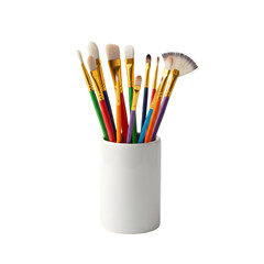 Assorted Art Brushes in White Ceramic Holder Studio Lighting Against Black Background