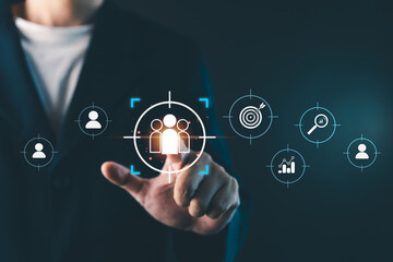Businessman touching virtual target audience icon, digital marketing strategy concept showing customer segmentation, data analytics, and business targeting for online marketing success