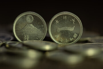 1943 one sen closeup captures several aged japanese 1 yen coins artifacts of history. © Mr