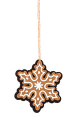 A gingerbread snowflake christmas ornament isolated on white background.
