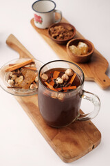Traditional Indonesian Herbal Drink (Wedang Uwuh) with Spices, Palm Sugar, and Rock Sugar.