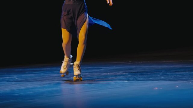 Roller Skater in White Quad Skates Performing on Blue Stage