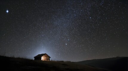 Peaceful night with nativity stable on hill under vast starlit sky
