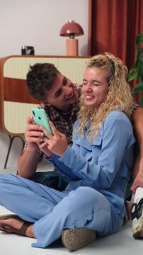 Two enthusiastic friends happily taking a selfie together using a smartphone, celebrating a joyful moment full of excitement and surprise, creating lasting memories and capturing their friendship.
