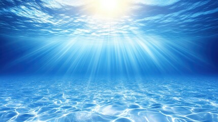 Underwater scene of sunlight piercing through ocean water