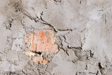 Photo of concrete wall with brickwork. Gray putty background. 