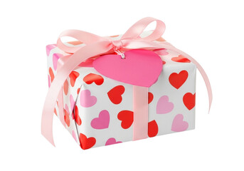 Gift box wrapped in paper with hearts and tied with a pink ribbon