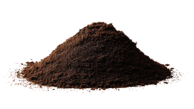Small mound of ground coffee resting on surface showing rich aroma and dark roasted texture on white background