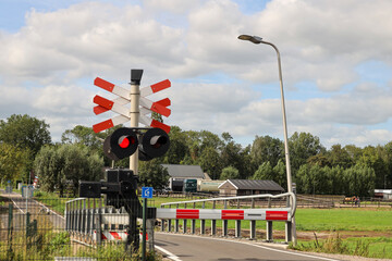 red light closed barrier at railroad crossing in Zuidplaspolder