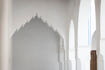 Ornate entrance arch and doorway inside the 19th century El Bahia Palace in Marrakesh, Morocco. A lambrequin arch at Bahia Palace, Marrakech.