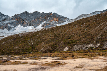 The highland mountain landscape of Daocheng Yading in Sichuan, China, is located in the eastern...