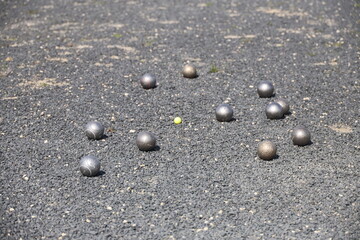 Petanque balls during play on the outdoor court of JBC Nieuwerkerk