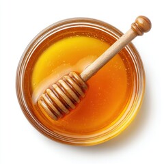 Overhead shot of honey in a glass jar with a wooden dipper on a white background sweet food ingredient natural sweetener