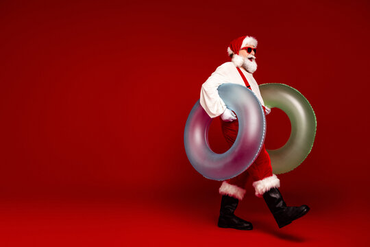 Santa with inflatable rings embraces festive fun for Christmas and holiday season