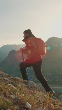 epic sunrise hike slow motion man with trekking poles cinematic mountain footage