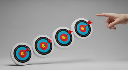 Hand pointing at multiple archery targets with arrows.