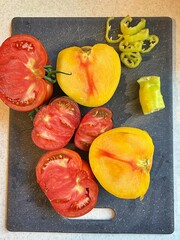 chopped tomatoes on a board, colorful tomatoes, bell pepper, vegetables from the garden