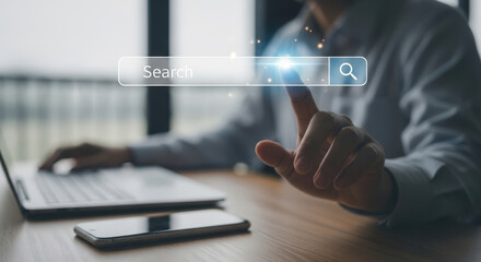 Person using laptop and searching online.