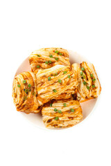 Handmade Spicy Pork Rolls with Green Onions on White Plate - Traditional Asian Pastry Food Photography