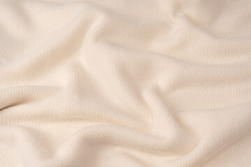 Fototapeta premium Soft milky color merino wool sweater texture as a background.