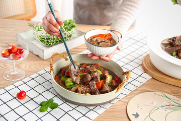 Traditional Beef Stew in Cast Iron Skillet - Farmhouse Kitchen Cooking Scene with Fresh Vegetables...