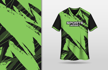 Abstract grunge black and green background for sports jersey design
