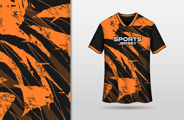 Abstract grunge black and orange background for sports jersey design
