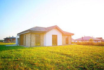 Countryside housing. Construction of modern one-story suburb house. Building New Home in...