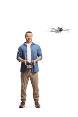 Casual man flying a drone