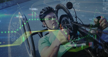 Reclining man wearing light green shirt and helmet cranking handcycle on paved track, overlaid data