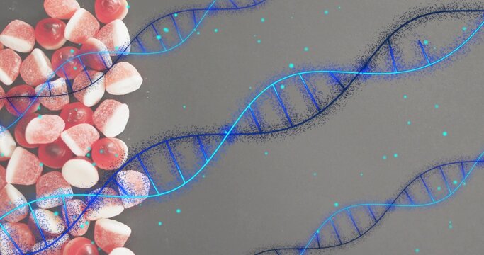 Naklejki Showing sugared gummy candies clustered left on gray table, with glowing blue DNA helix, copy space