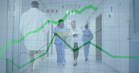 Walking nurse in scrubs and doctor in white coat talking in hospital, holding charts, green graphs