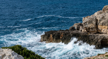 Waves crashing on rocks  of the cliff of Punta Ristola, extreme south of Salento