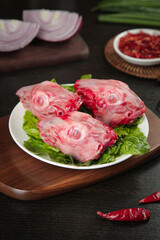 Fresh Raw Rabbit Heads on Plate Ready for Traditional Chinese Cooking Preparation