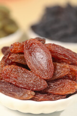 Xinjiang Turpan Ruby Red Dried Raisins in White Bowl - Premium Chinese Dried Fruits