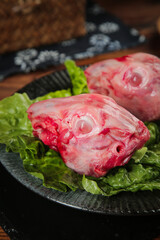 Fresh Raw Rabbit Heads on Lettuce Leaves - Chongqing Traditional Meat Market Wholesale Display