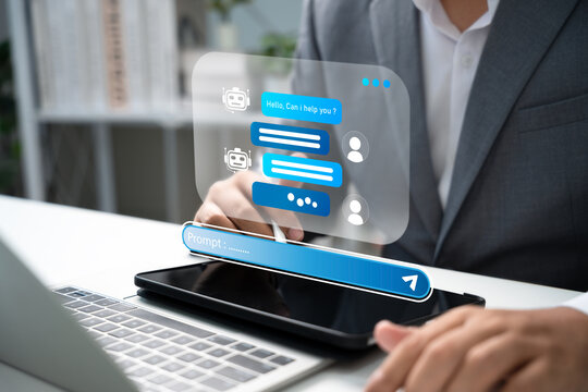 Businessman interacting with AI chatbot on digital device, showcasing prompt-based conversation, customer support automation, and intelligent communication in modern digital business.