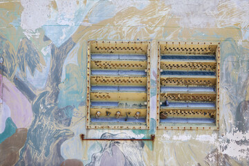 Abstract Peeling Paint Wall with Rusted Metal Ventilation Grille
