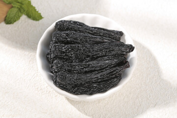 Black Xinjiang Raisins in White Bowl - Premium Dried Fruit Healthy Snack Food Photography